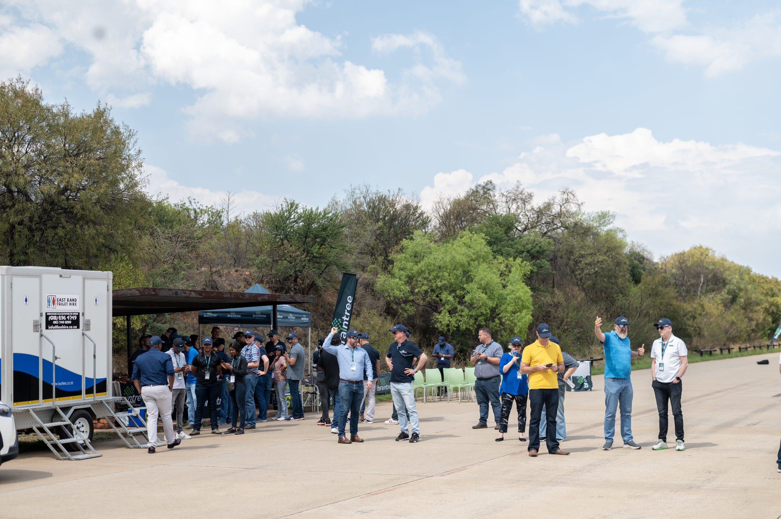 Braintree employees standing around on a road - 12