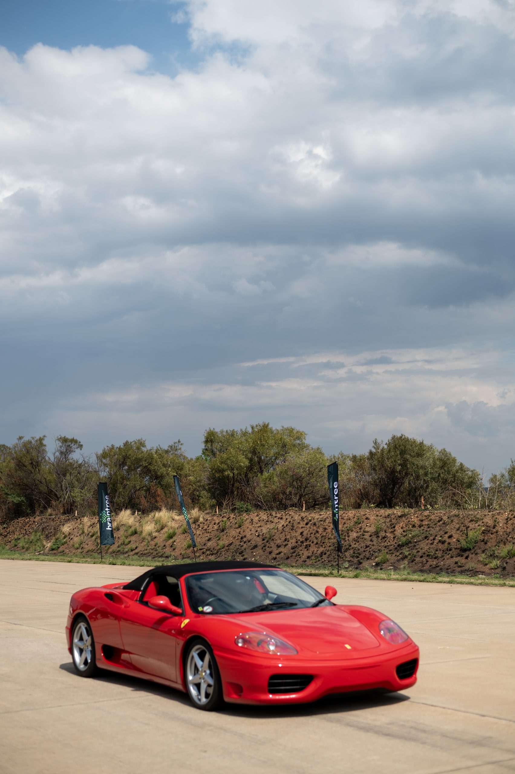 red Ferrari standing still on a road