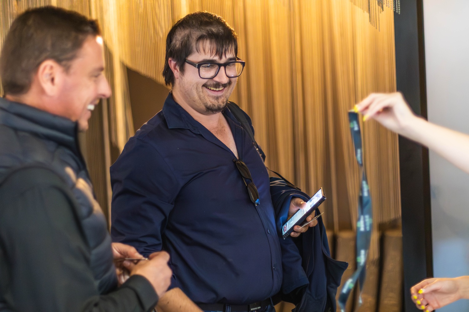 A guest smiling warmly in conversation