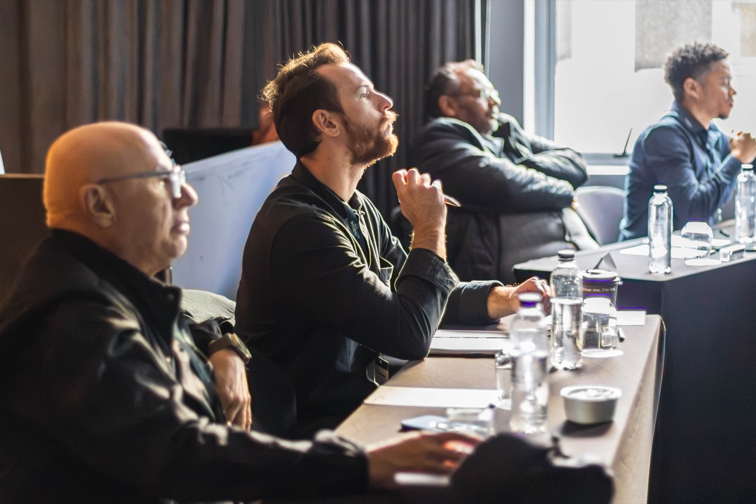 Attendees listening intently during a session