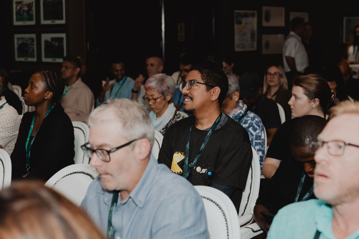 The audience listening attentively during a session