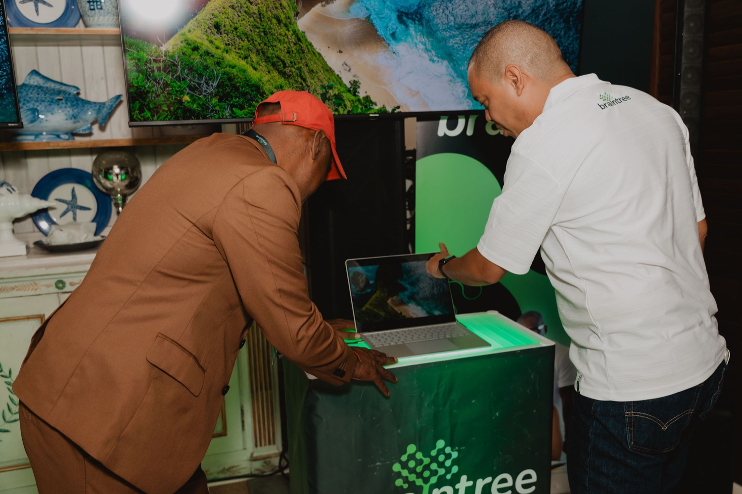 Attendees exploring a Surface device at the branded demo station