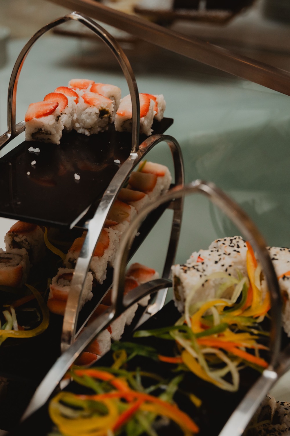 An elegant tiered platter of canapés