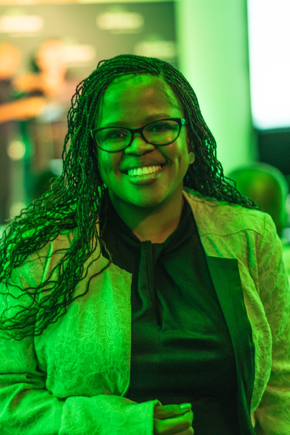 A guest smiling warmly during the event