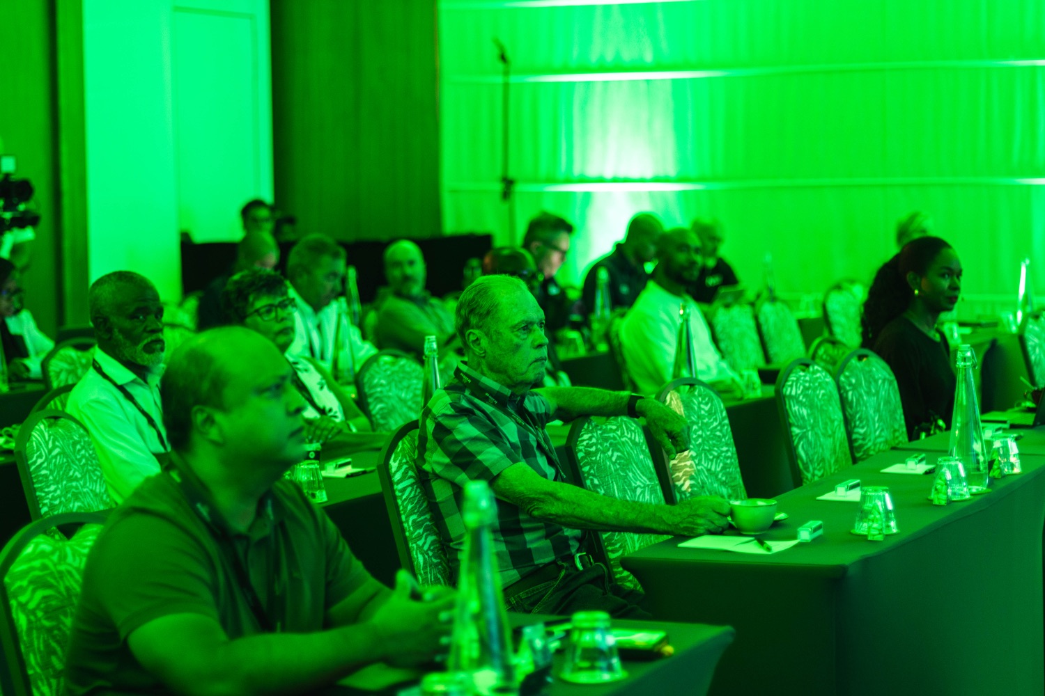 Guests seated and listening during a session