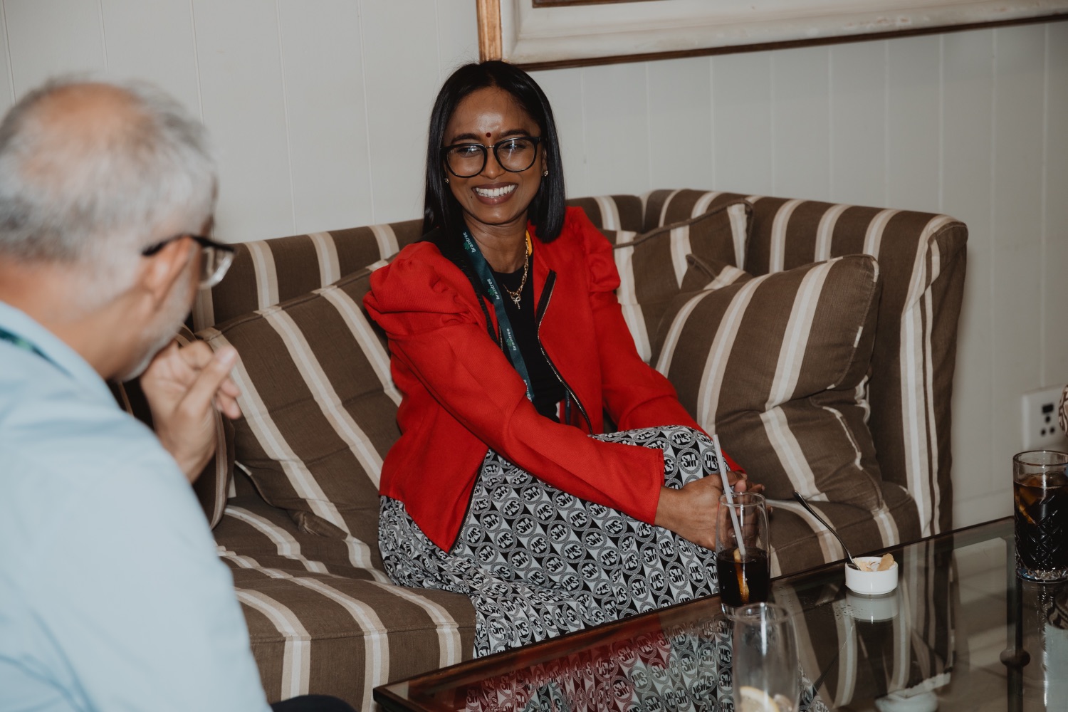 A smiling guest seated in the lounge