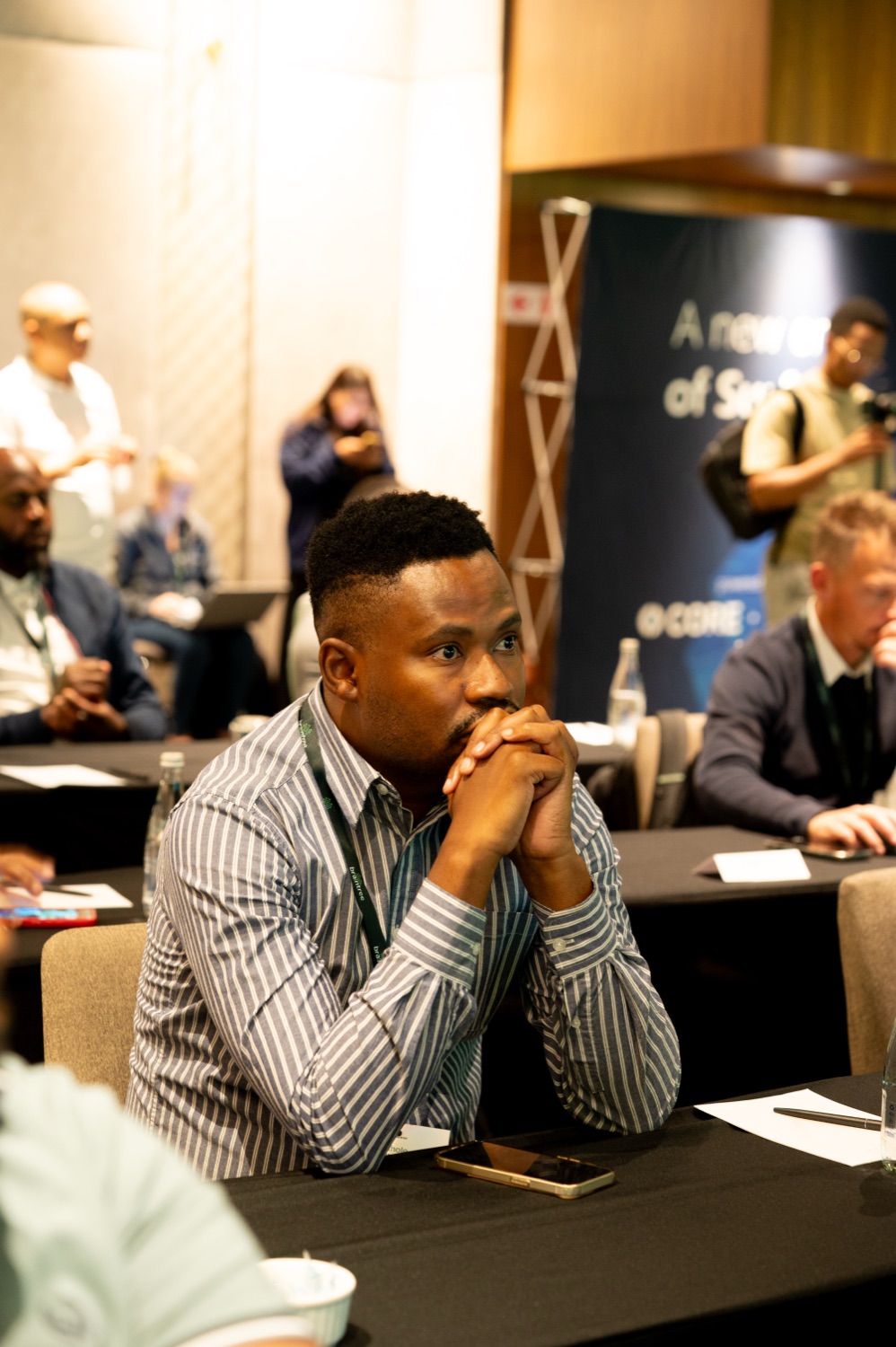 An attendee listening intently during a session