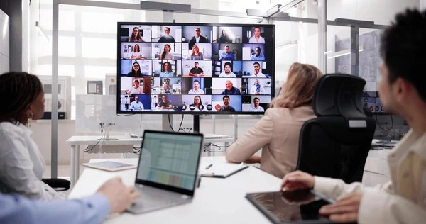 A hybrid standup on Microsoft Teams. The workplace we run, in the room and on the call.